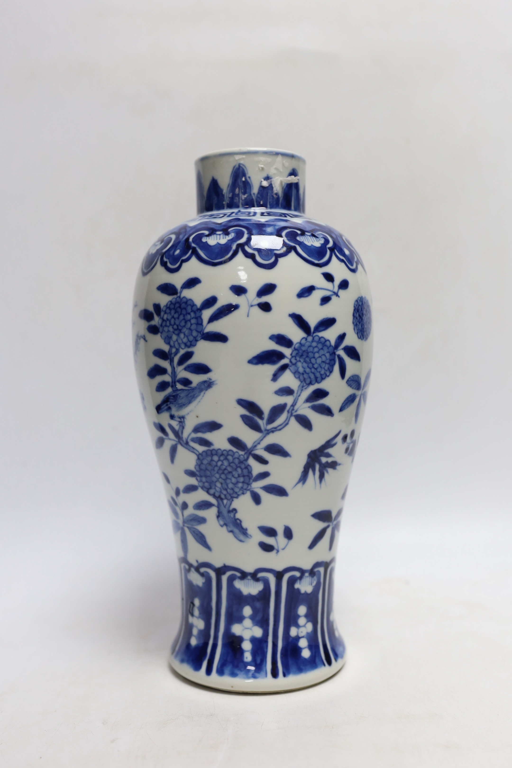A Chinese blue and white baluster 'blackbirds amid blossom' vase, Kangxi mark, but late 19th century, 27cm